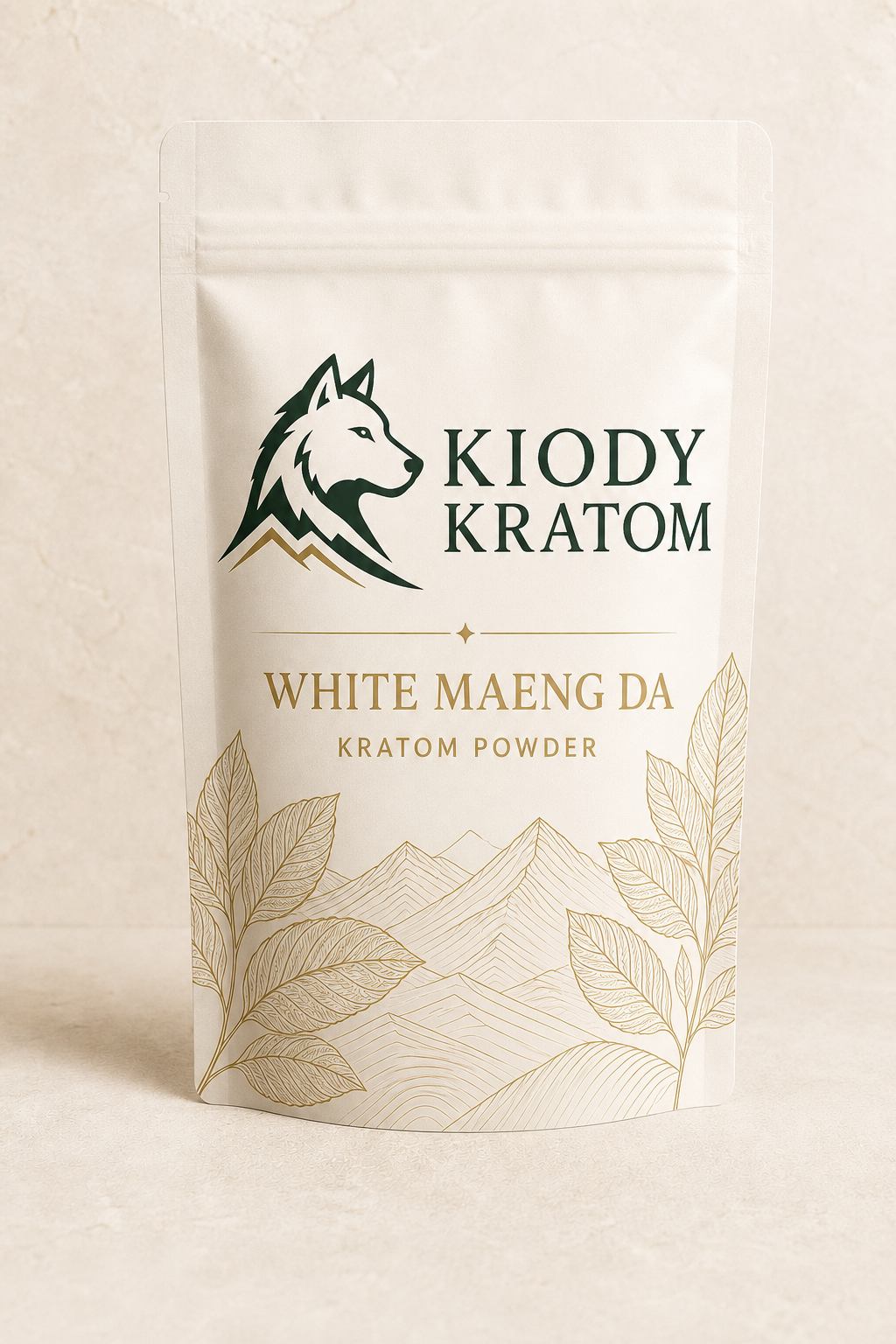 Kiody White Maeng Da kratom powder in a warm ivory 100 gram pouch with gold kratom leaves and mountain lines