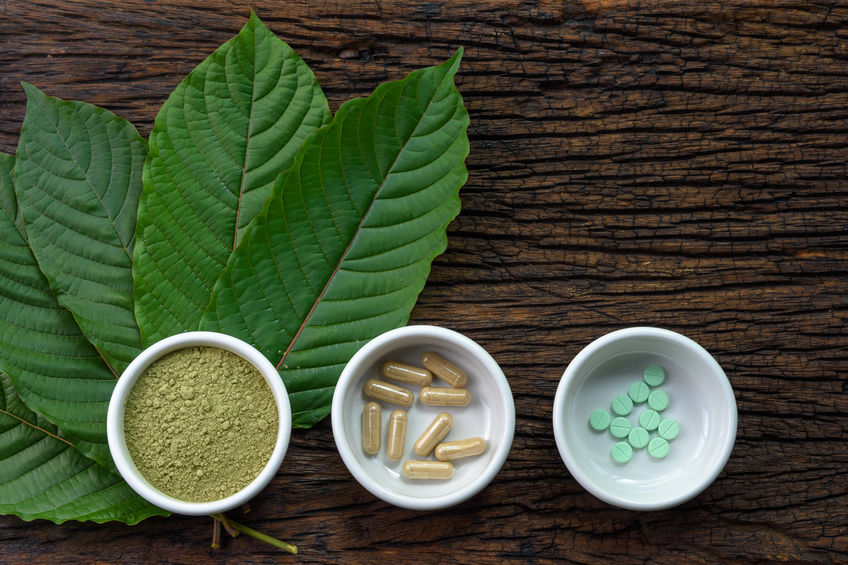 kratom leaves with pills and capsules