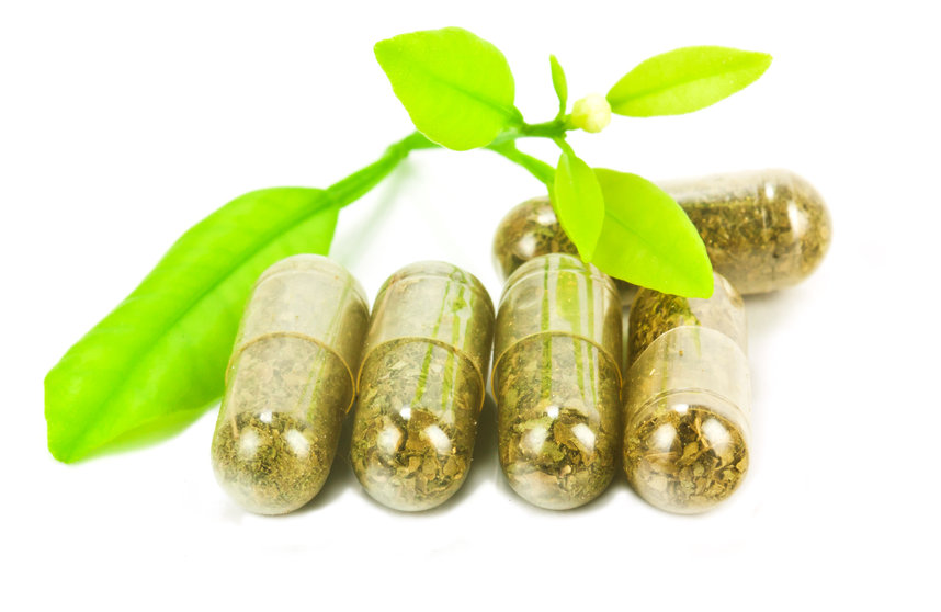 herbal medicine pills with green plant