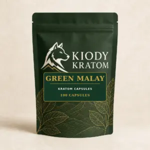 Kiody Green Malay Kratom Capsules 100-count bag with current wolf logo and antique-gold botanical inlay