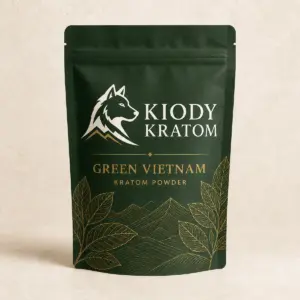 Kiody Green Vietnam Kratom powder in a forest-green pouch with gold botanical artwork
