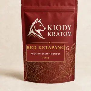 Kiody Premium Red Ketapang Kratom Powder 100 g bag with current wolf logo and antique-gold botanical inlay