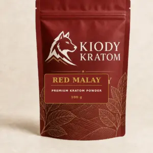 Kiody Premium Red Malay Kratom Powder 100 g bag with current wolf logo and antique-gold botanical inlay