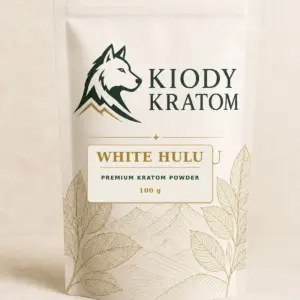 Kiody Premium White Hulu Kratom Powder 100 g bag with current wolf logo and antique-gold botanical inlay