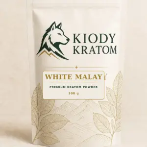 Kiody Premium White Malay Kratom Powder 100 g bag with current wolf logo and antique-gold botanical inlay