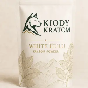 Kiody White Hulu Kratom powder in a warm-ivory pouch with gold botanical artwork