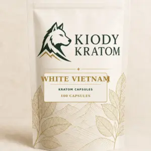 Kiody White Vietnam Kratom Capsules 100-count bag with current wolf logo and antique-gold botanical inlay