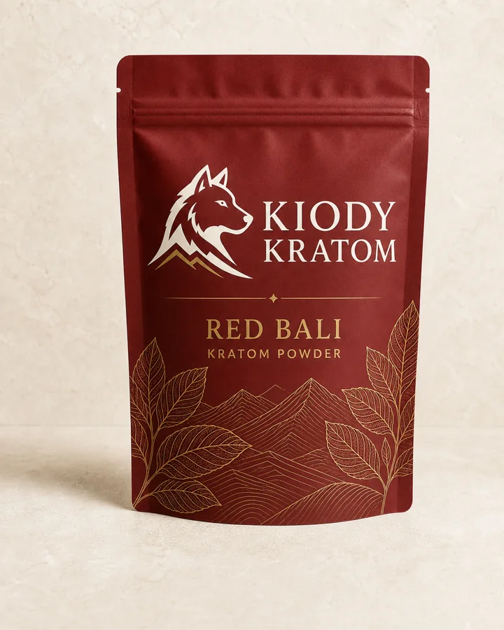 Kiody Red Bali kratom powder in a clay red 100 gram pouch with gold kratom leaves and mountain lines